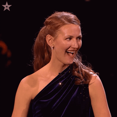 A Woman Covering Her Face With Her Hands With A Star In The Corner GIF