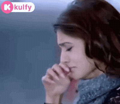 A Woman Covering Her Mouth With Her Hands With A K Kulfy Logo In The Corner GIF