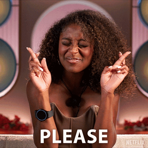 A Woman Crosses Her Fingers In Front Of A Netflix Logo GIF