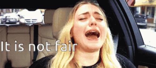 A Woman Crying In A Car With The Words " It Is Not Fair " Behind Her GIF