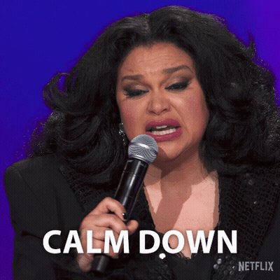 A Woman Crying While Holding A Microphone With The Words Calm Down Written Below Her GIF