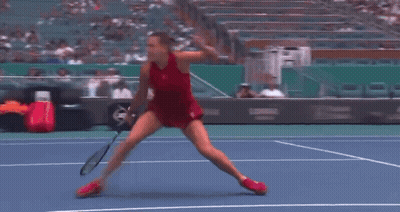 A Woman Doing A Split On A Tennis Court In Front Of A Pnc Bank Sign GIF