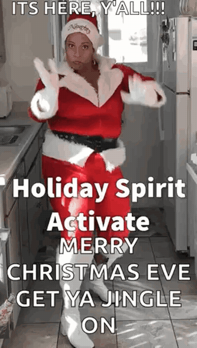 A Woman Dressed As Santa Claus Is Dancing In A Kitchen GIF