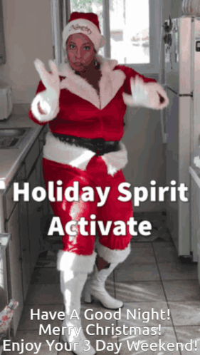 A Woman Dressed As Santa Claus Is Dancing In A Kitchen With The Words Holiday Spirit Activate Above Her GIF