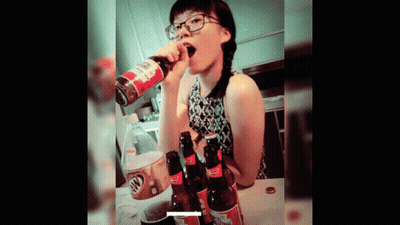 A Woman Drinking A Bottle Of Root Beer From A Can GIF