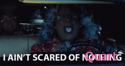 A Woman Driving A Car With The Words " I Ain T Scared Of Nothing " GIF
