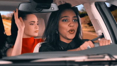 A Woman Driving A Car With Two Other Women GIF