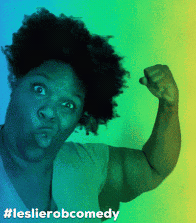 A Woman Flexing Her Muscles With The Hashtag Leslierobcomedy GIF
