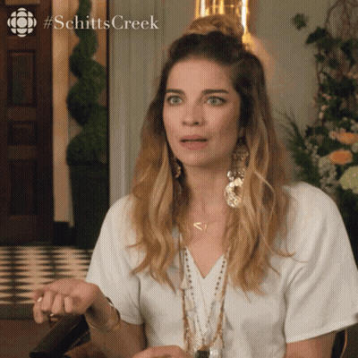 A Woman From Schitts Creek Making A Surprised Face GIF