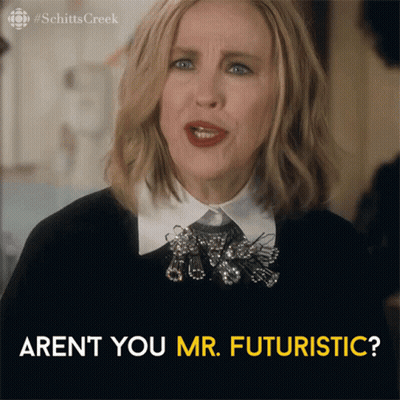 A Woman From Schitts Creek Says " Aren 'T You Mr. Futuristic ? " GIF