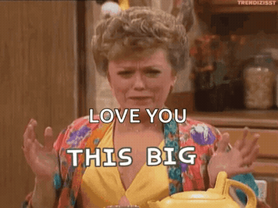 A Woman From The Golden Girls Is Sitting At A Table With A Teapot . GIF