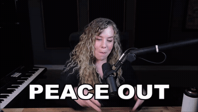 A Woman Giving A Peace Sign In Front Of A Microphone With The Words Peace Out Written Below Her GIF