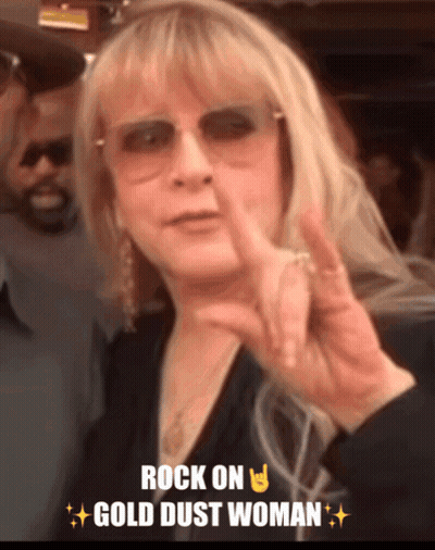 A Woman Giving A Peace Sign With The Words Rock On Gold Dust Woman GIF
