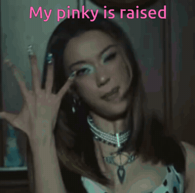 A Woman Giving A Thumbs Up With The Words My Pinky Is Raised GIF