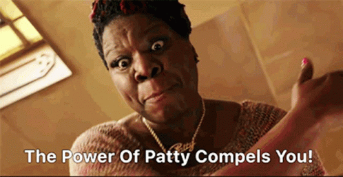 A Woman Giving A Thumbs Up With The Words " The Power Of Patty Compels You " GIF