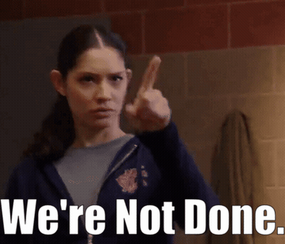 A Woman Giving The Middle Finger With The Words " We 'Re Not Done " Below Her GIF
