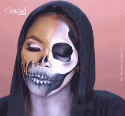 A Woman Has Her Face Painted To Look Like A Skeleton And Crowned Ladies Is Behind Her GIF