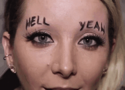 A Woman Has The Words Hell And Yeah Written On Her Face . GIF