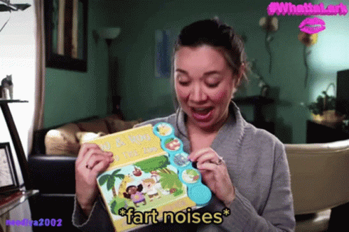 A Woman Holding A Book That Says " Fart Noises " GIF
