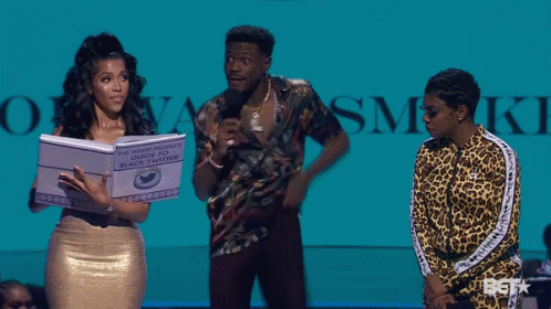 A Woman Holding A Book Titled The White People 'S Guide To Black Twitter GIF