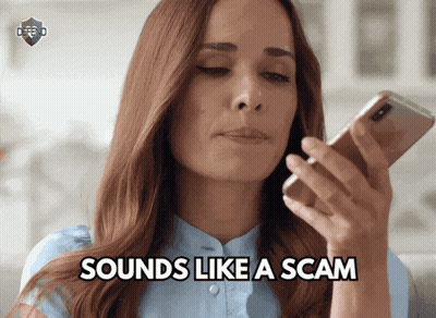 A Woman Holding A Cell Phone With The Words " Sounds Like A Scam " Below Her GIF