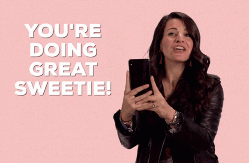 A Woman Holding A Cell Phone With The Words You 'Re Doing Great Sweetie GIF