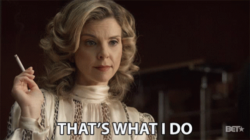 A Woman Holding A Cigarette With The Words That 'S What I Do Behind Her GIF