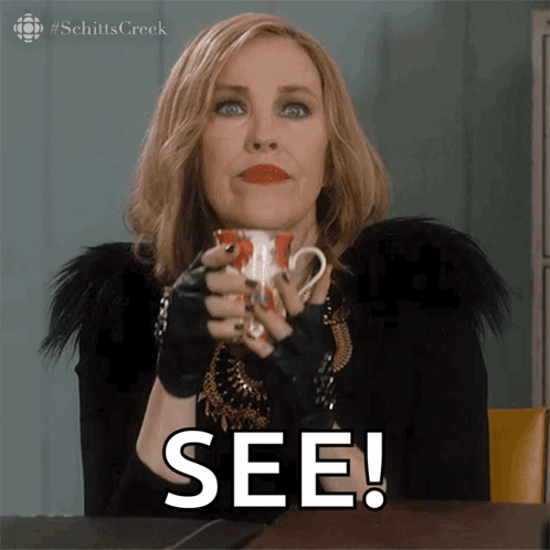 A Woman Holding A Cup With The Word See On The Bottom GIF