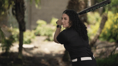 A Woman Holding A Easton Baseball Bat In Her Hand GIF