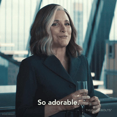 A Woman Holding A Glass Of Wine And Saying So Adorable GIF