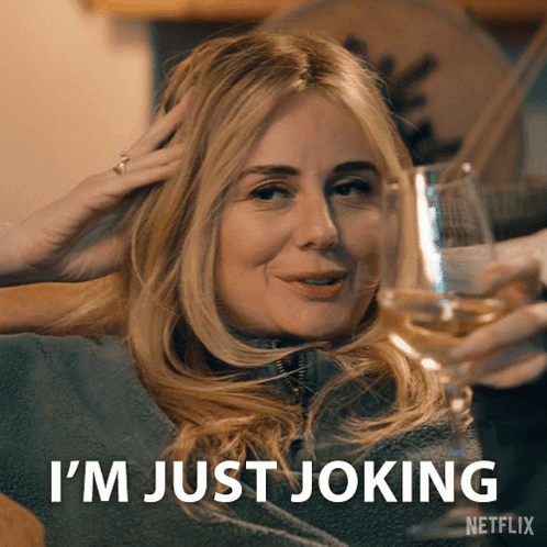 A Woman Holding A Glass Of Wine Says I 'M Just Joking Netflix GIF