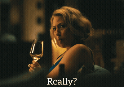 A Woman Holding A Glass Of Wine With The Word Really Behind Her GIF