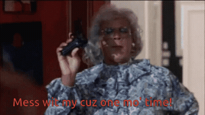 A Woman Holding A Gun With Mess Wit My Cuz One Mo Time Written In Red GIF