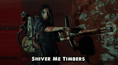 A Woman Holding A Gun With The Words Shiver Me Timbers Written Below Her GIF