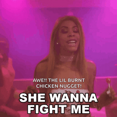A Woman Holding A Lollipop With The Words She Wanna Fight Me Below Her GIF