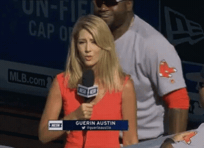 A Woman Holding A Microphone With The Name Guerin Austin On Her Shirt GIF