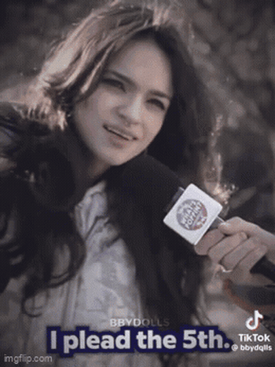 A Woman Holding A Microphone With The Words I Plead The 5Th GIF