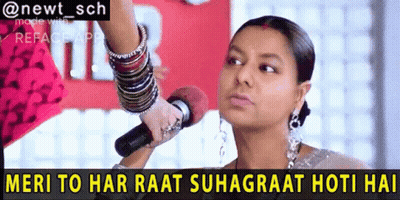 A Woman Holding A Microphone With The Words Meri To Har Raat Suhagraat Hoti Hai GIF