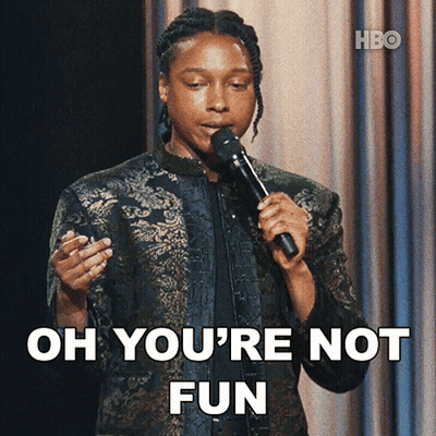 A Woman Holding A Microphone With The Words Oh You 'Re Not Fun Behind Her GIF