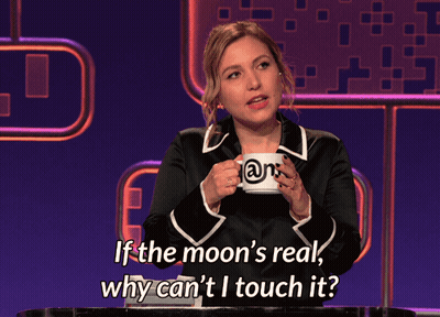 A Woman Holding A Mug That Says ' @N ' On It GIF