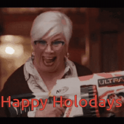 A Woman Holding A Nerf Gun With The Words Happy Holodays Written On It GIF