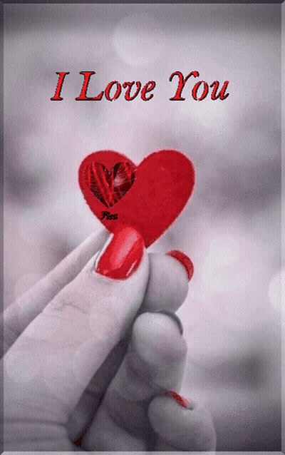 A Woman Holding A Red Heart With The Words I Love You On The Bottom GIF