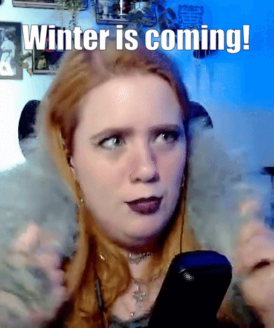 A Woman Holding A Remote With The Words Winter Is Coming GIF