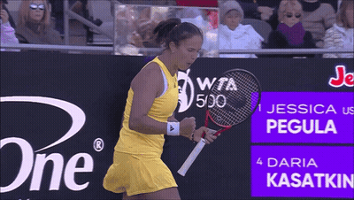 A Woman Holding A Tennis Racquet In Front Of A Sign That Says Jessica Pegula GIF