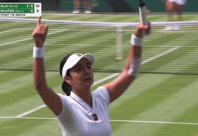 A Woman Holding A Tennis Racquet On A Court With A Scoreboard In The Background That Says Point Tie-Break GIF