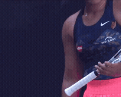 A Woman Holding A Tennis Racquet That Says Workday GIF