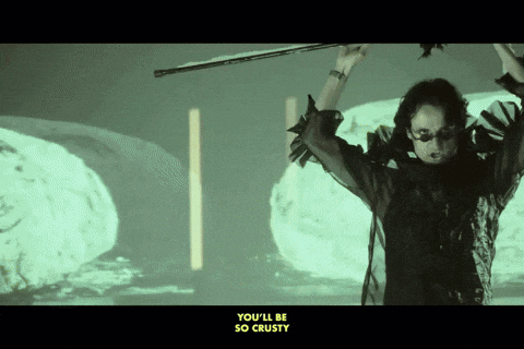 A Woman Holding A Violin With The Words " You 'Ll Be So Crusty " Below Her GIF
