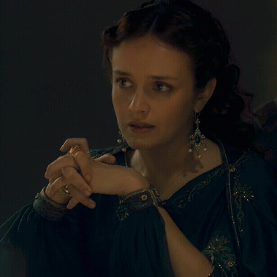A Woman Holding A Wine Glass With The Words Of Course Written Below Her GIF