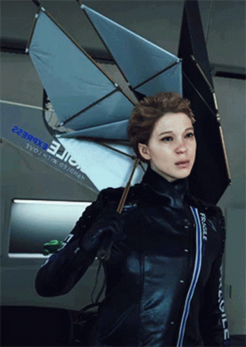 A Woman Holding An Umbrella With The Word Fragile On Her Jacket GIF