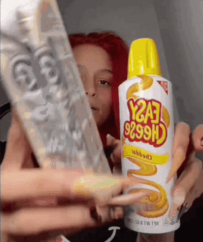 A Woman Holds A Bottle Of Y2a3 9299H GIF